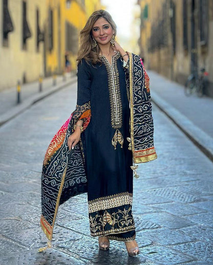 "Be the epitome of elegance and style with our designer party wear sharara suit set, tailored to perfection for the modern woman who loves to make a statement."