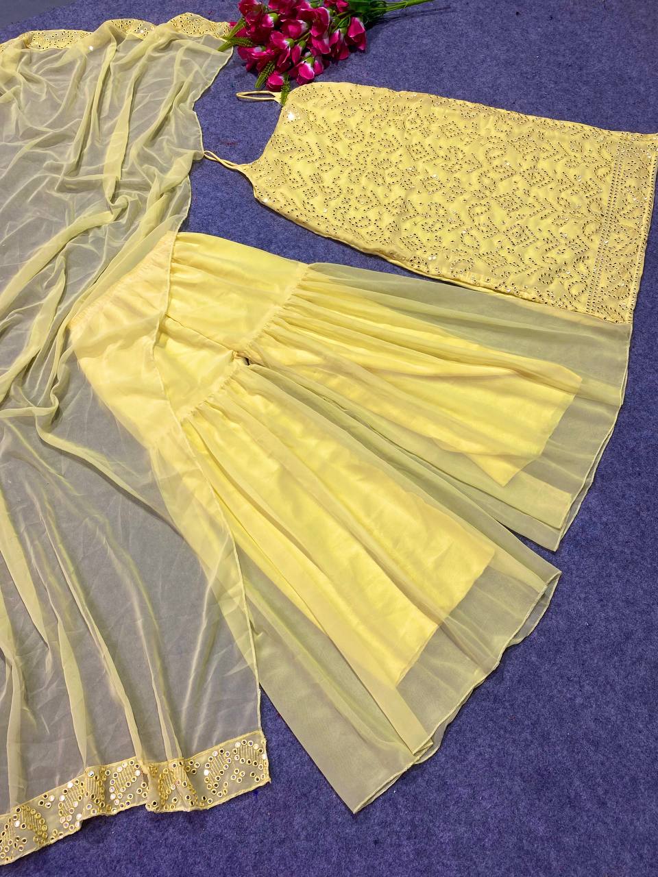 Lemon Yellow Colour Embroidered Attractive Party Wear Faux Georgette Top Plazzo has a Regular-fit and is Made From High-Grade Fabrics And Yarn.