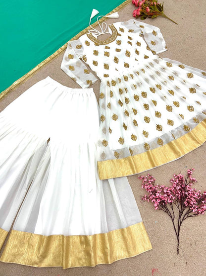 How about: "Effortlessly elegant: Faux Georgette Top, Plazo, and Dupatta Set – Your statement of style."